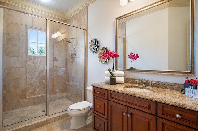 bathroom featuring vanity, a textured ceiling, crown molding, tile patterned flooring, and toilet