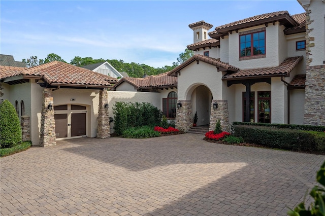 mediterranean / spanish house featuring a garage