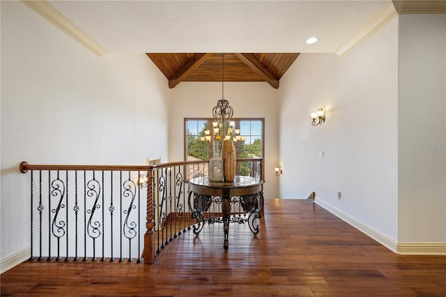 dining space featuring vaulted ceiling with beams, dark hardwood / wood-style flooring, crown molding, and an inviting chandelier