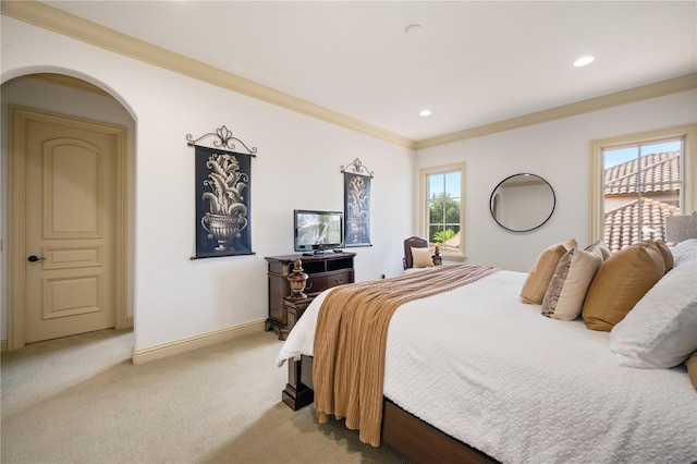 bedroom featuring multiple windows, light carpet, and crown molding