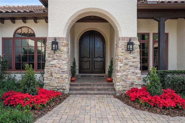 view of exterior entry featuring french doors