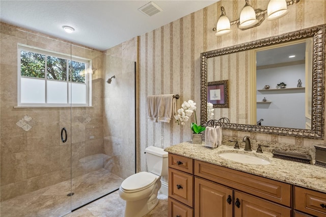 bathroom with vanity, toilet, and walk in shower