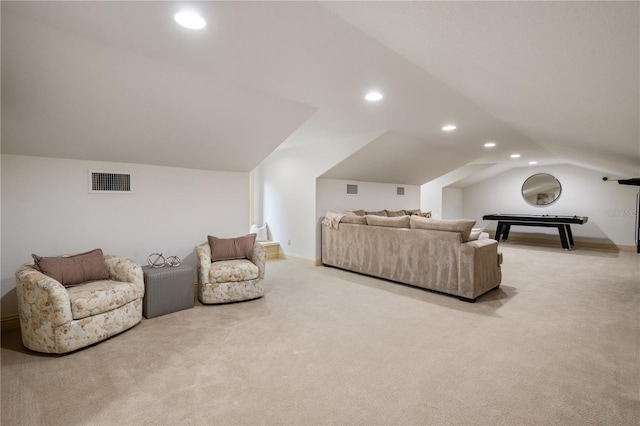 carpeted living room featuring vaulted ceiling