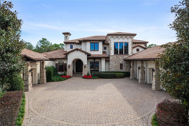 mediterranean / spanish-style house featuring a garage