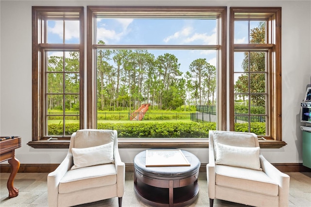 sunroom / solarium featuring a healthy amount of sunlight