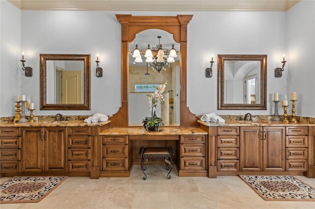 bathroom featuring crown molding, tile patterned flooring, vanity, and a notable chandelier