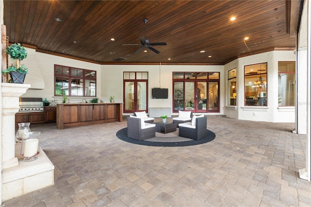 view of patio / terrace with outdoor lounge area, french doors, an outdoor kitchen, ceiling fan, and area for grilling