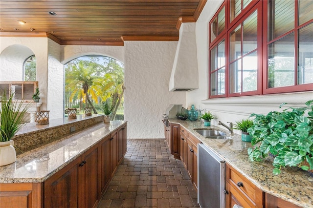 view of patio with grilling area and sink