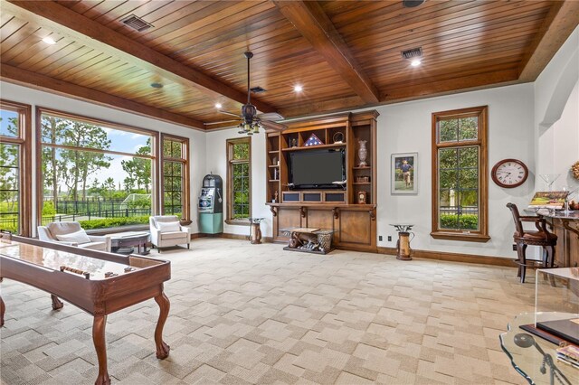 living room featuring ceiling fan, plenty of natural light, light colored carpet, and wooden ceiling