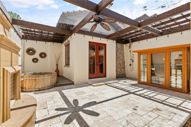 view of patio featuring ceiling fan and french doors