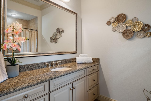 bathroom featuring vanity, walk in shower, and ornamental molding