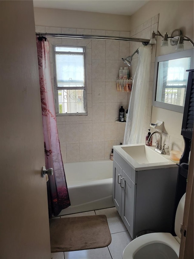 full bathroom featuring tile patterned flooring, vanity, shower / tub combo with curtain, and toilet