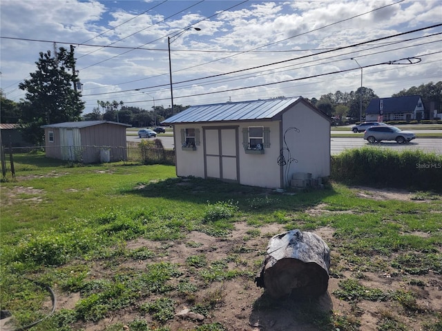 view of outbuilding with a lawn