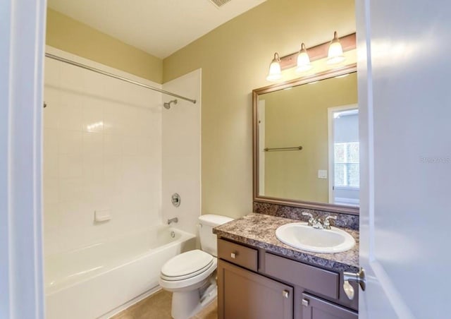 full bathroom featuring tile patterned flooring, toilet, vanity, and bathing tub / shower combination