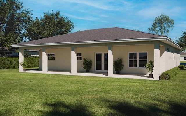 back of property with french doors and a lawn