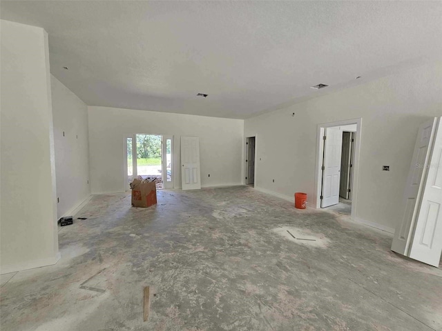 unfurnished room featuring a textured ceiling