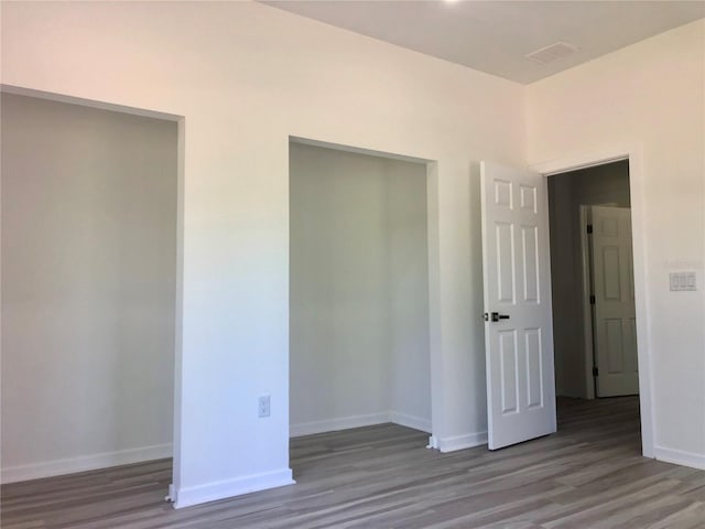 7539 Bernal Dr, Sebring, FL 33872 - unfurnished bedroom featuring wood finished floors and baseboards