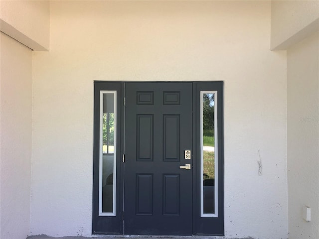 7539 Bernal Dr, Sebring, FL 33872 - property entrance with stucco siding