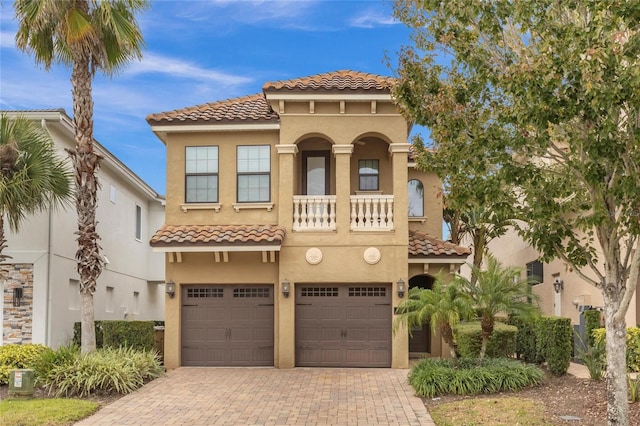 mediterranean / spanish house with a garage