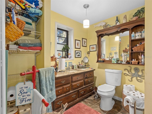 bathroom featuring vanity, toilet, and tile patterned flooring