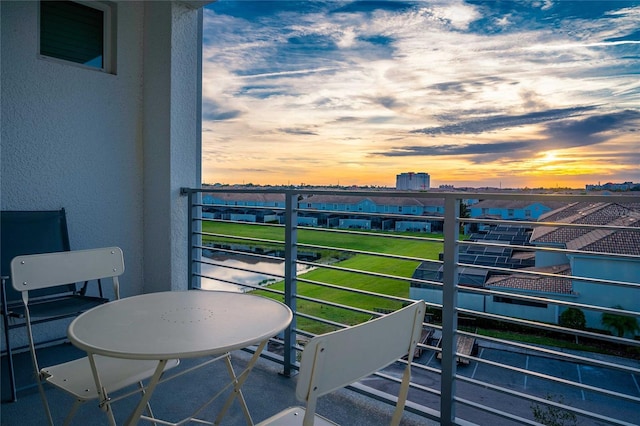 view of balcony at dusk