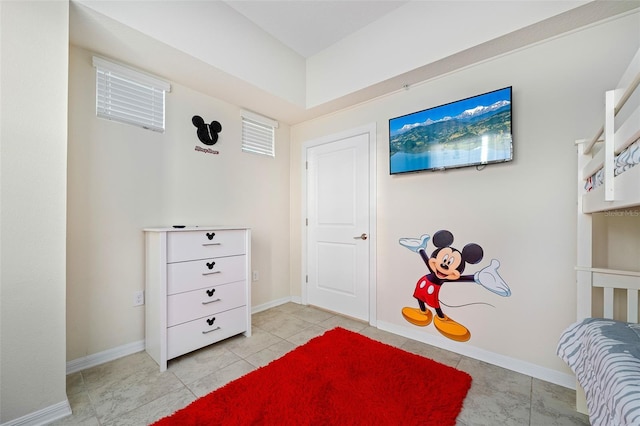 bedroom featuring baseboards