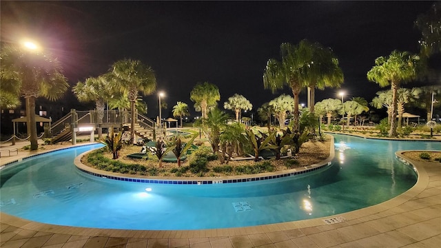 pool at night with a community pool