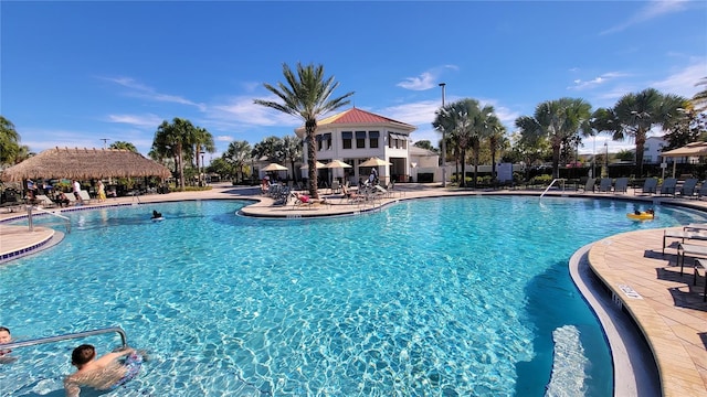 pool featuring a patio and fence