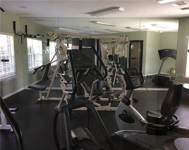 gym with a textured ceiling