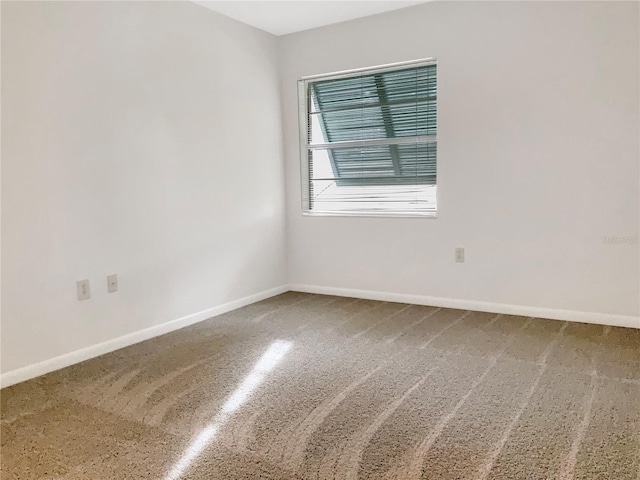 unfurnished room with carpet floors