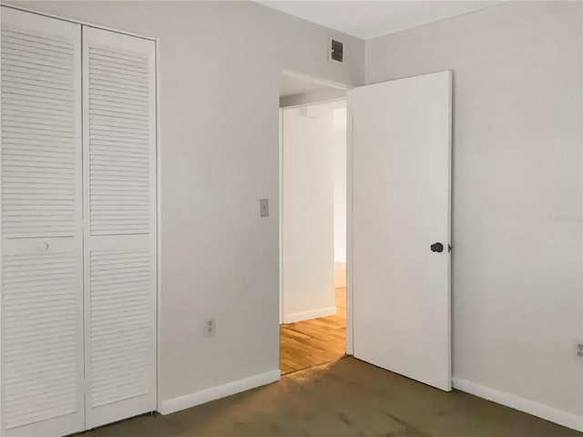 unfurnished bedroom featuring a closet