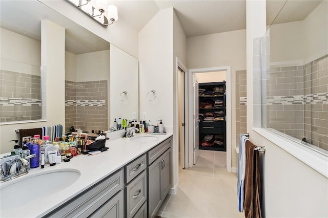 bathroom featuring tile patterned flooring and vanity