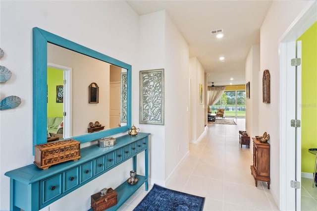 hallway featuring light tile patterned floors