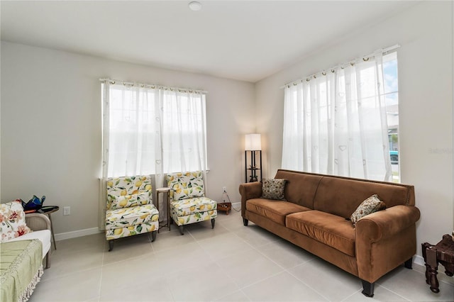 tiled living room with a healthy amount of sunlight