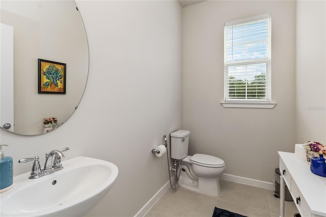 bathroom with tile patterned floors, toilet, and sink