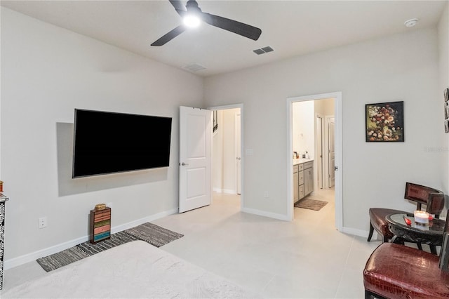 interior space featuring ceiling fan and ensuite bath