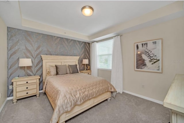 bedroom with carpet floors and baseboards