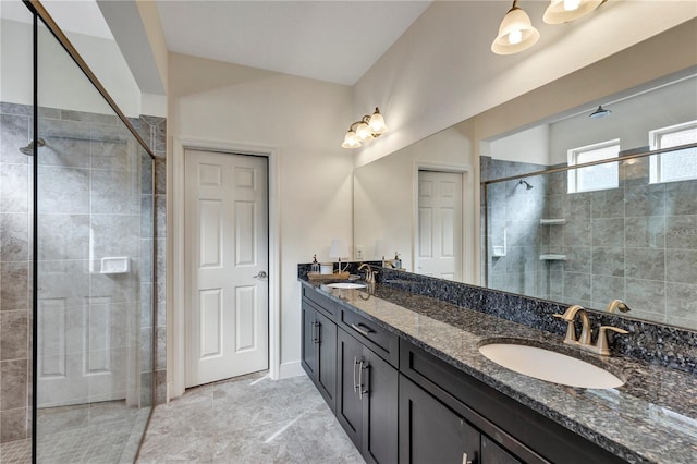 bathroom with vanity and a shower with door