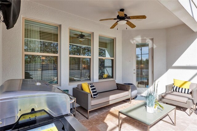 view of patio / terrace featuring ceiling fan, an outdoor living space, and area for grilling