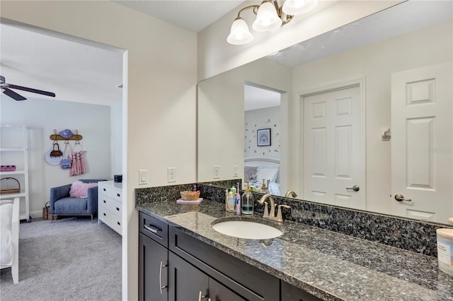 bathroom featuring vanity and ceiling fan