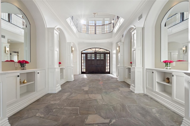 entrance foyer featuring a towering ceiling