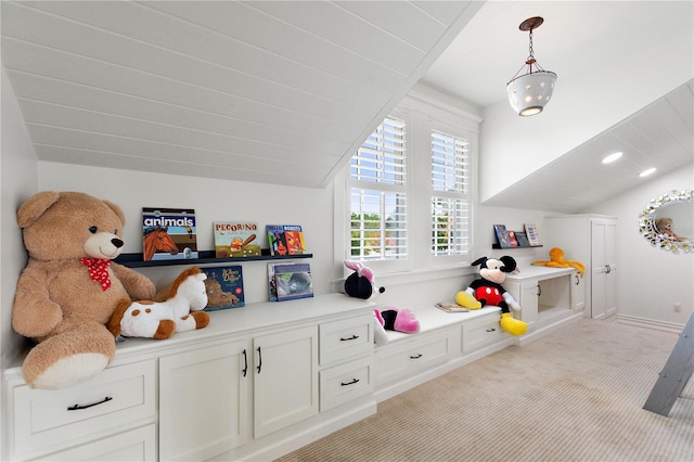 playroom with light colored carpet and lofted ceiling