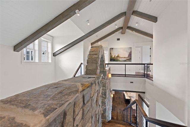 stairway with lofted ceiling with beams