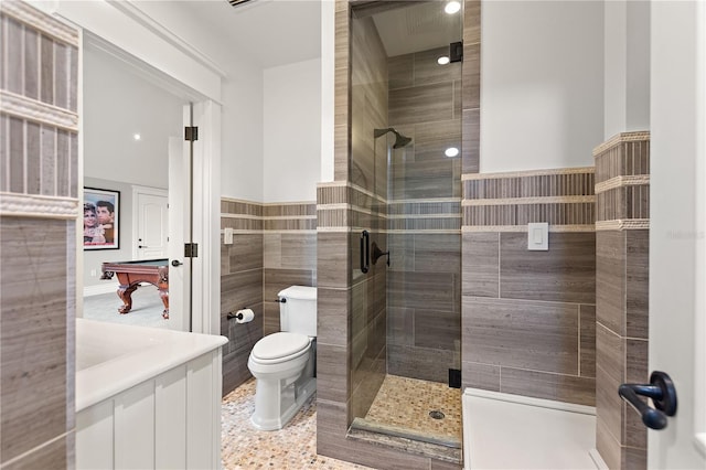 bathroom featuring pool table, tile walls, an enclosed shower, and toilet