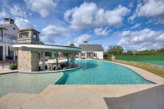 view of swimming pool with a patio area