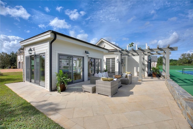 rear view of property featuring a patio area, a pergola, and outdoor lounge area