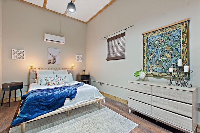bedroom with dark wood-type flooring and a wall unit AC