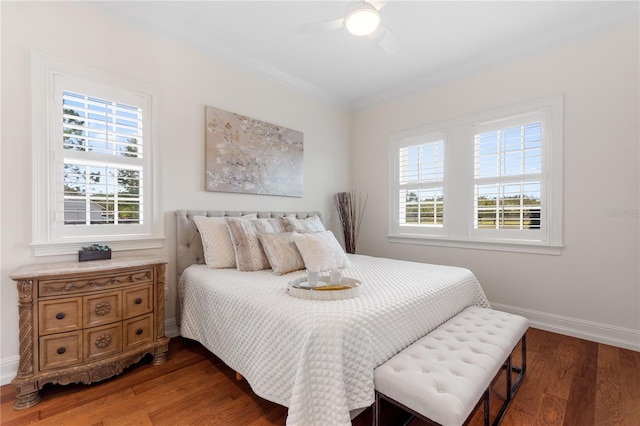 bedroom with ceiling fan and dark wood-type flooring