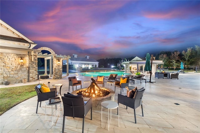 patio terrace at dusk with a fire pit