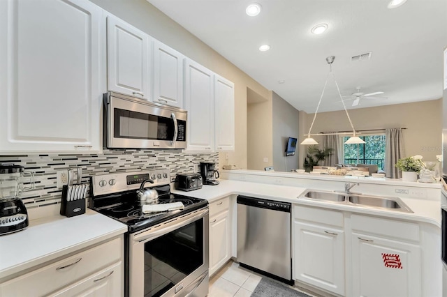 kitchen with light tile patterned floors, white cabinets, ceiling fan, stainless steel appliances, and sink